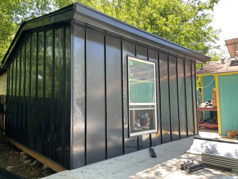 Black standing seam metal wall panels for Metal Roof Installation in Hubbard