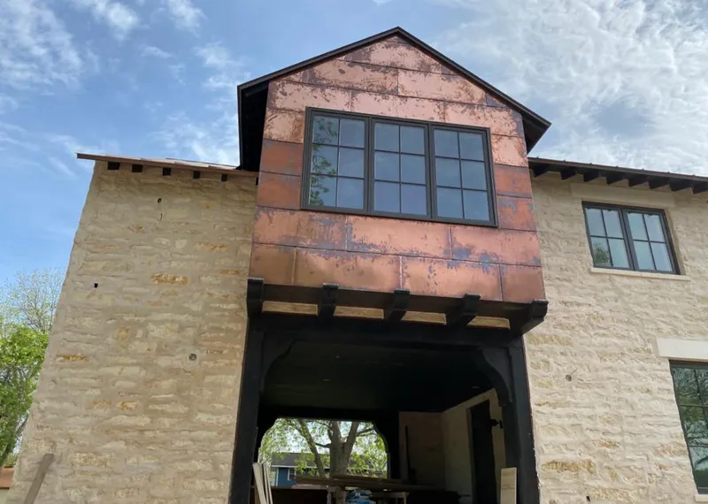 Copper metal panel facade on a stone building for Metal Roof Coating in Hubbard